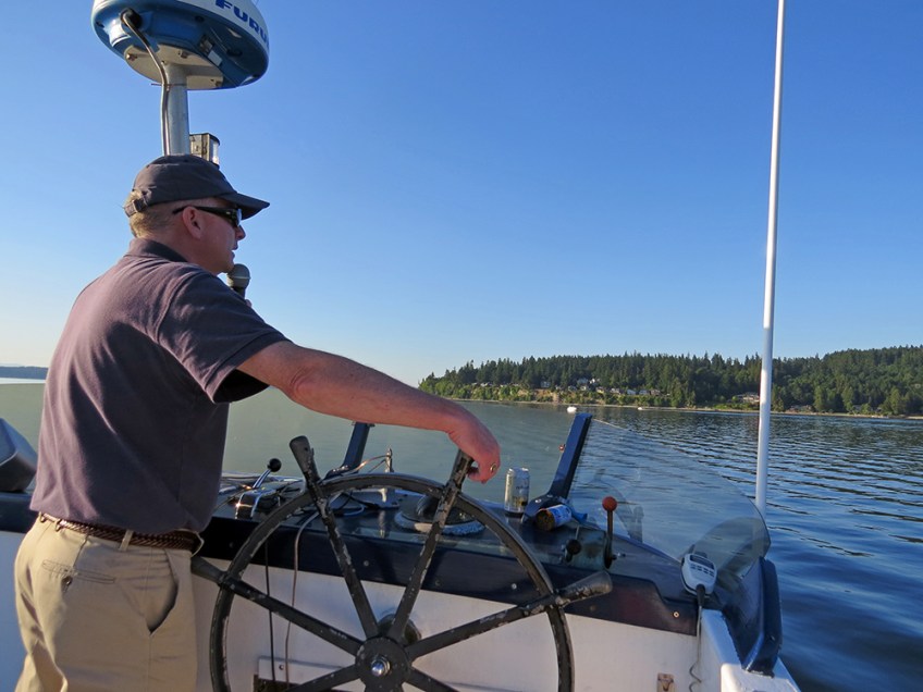 Photo of Captain Tom steering the boat